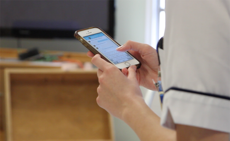 Nurse using the Medic Bleep app to communicate