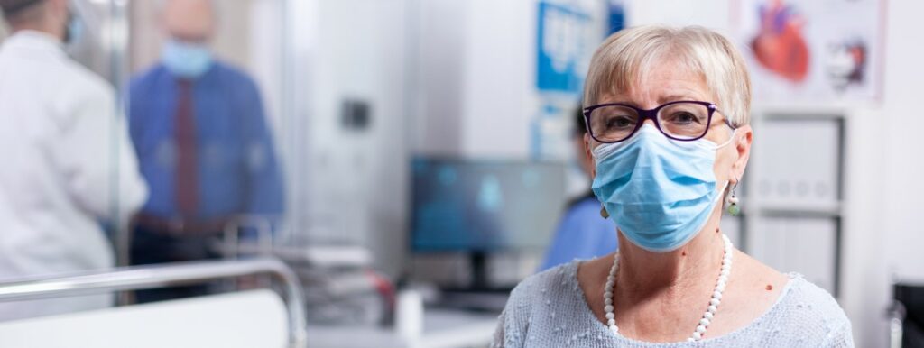 Older woman in secondary care waiting area