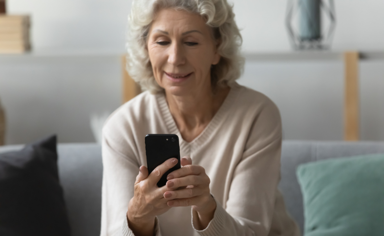 Elderly lady uses phone