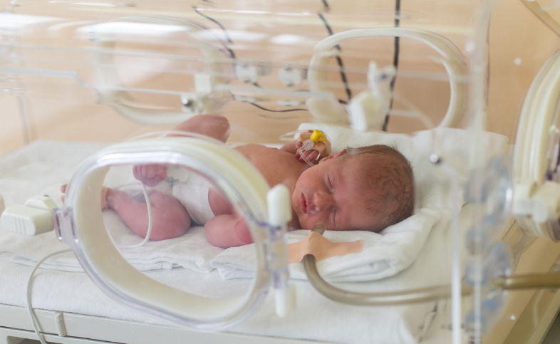 Baby in hospital incubator