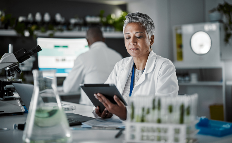 Researcher using ipad in lab
