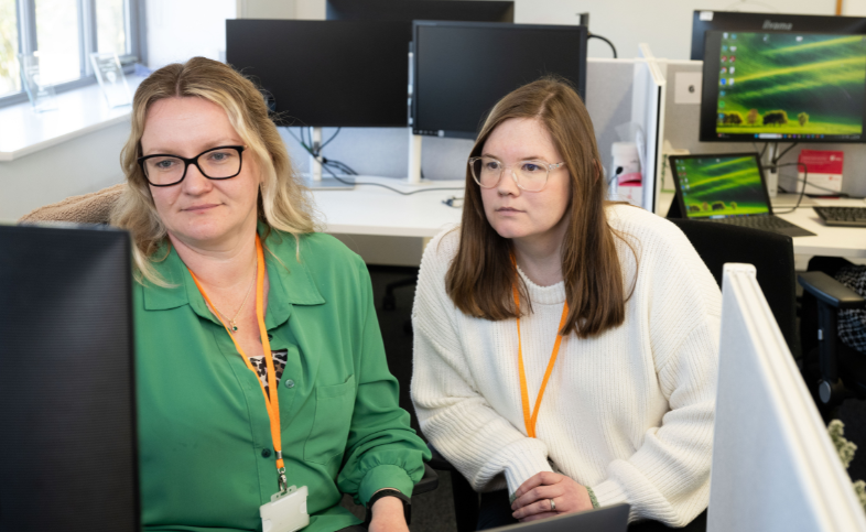Sophie and Louise work at a laptop together