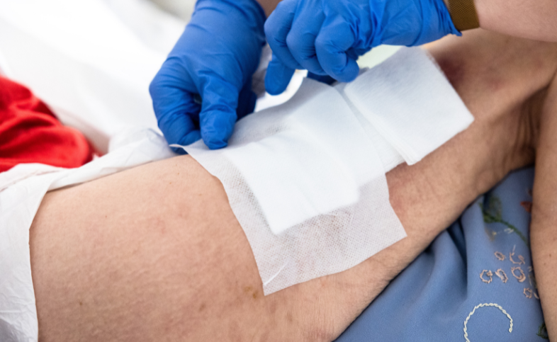 Wound being covered in medical dressings