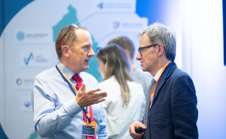 At the East of England APPG Eddie Morris, regional medical director for the East of England and Piers Ricketts, CEO of Health Innovation East discuss with each other
