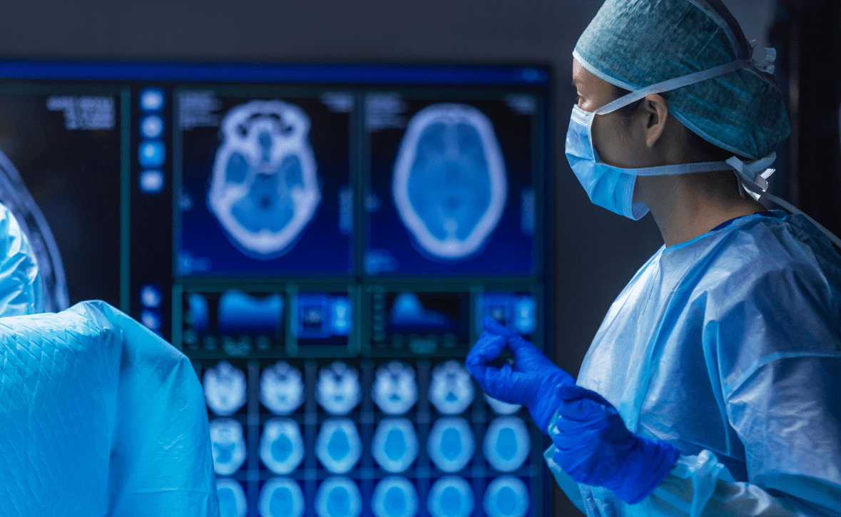 Surgeon in scrubs and gloves wears