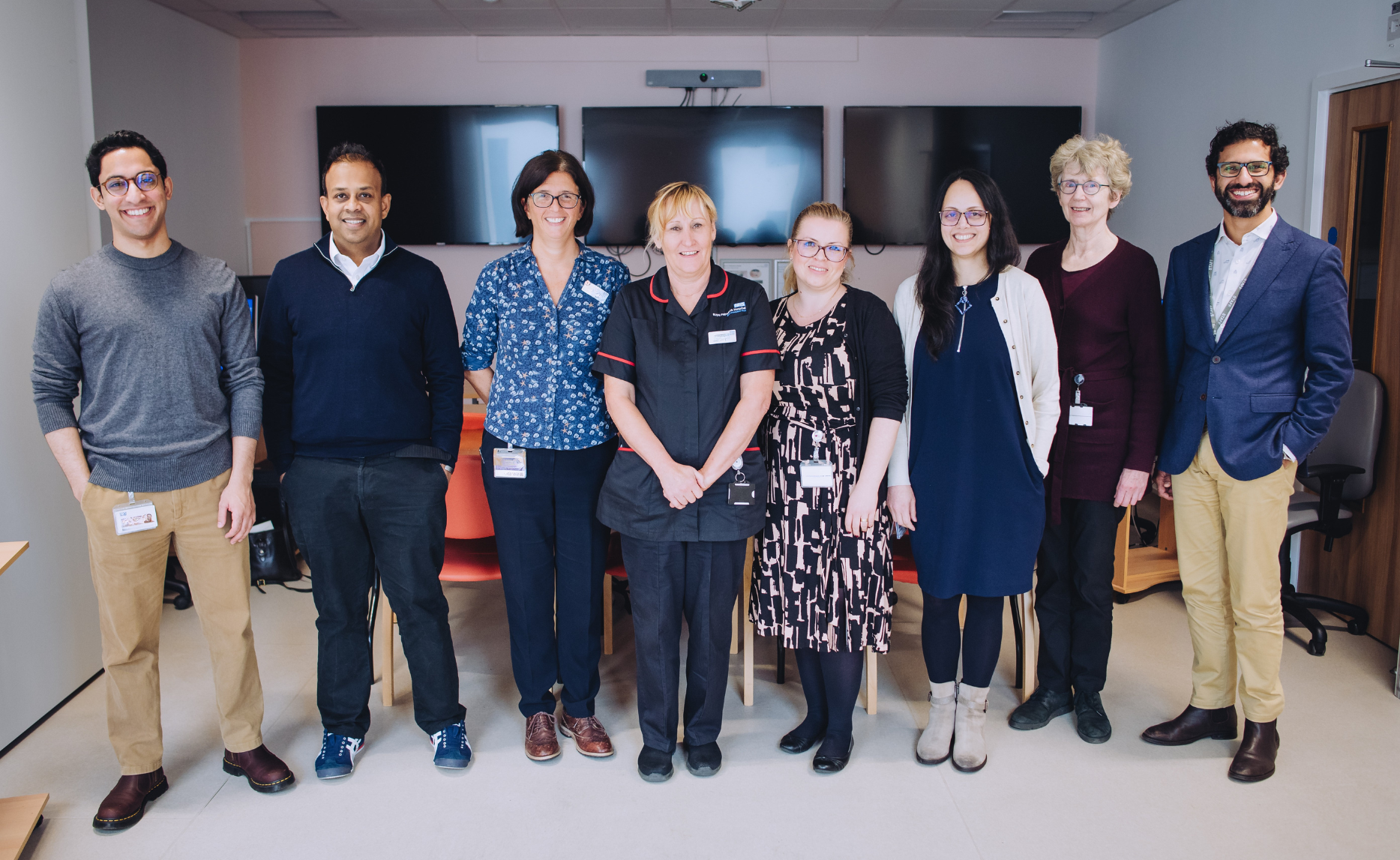 The multidisciplinary interstitial lung disease team at Royal Papworth Hospital stand in a line together