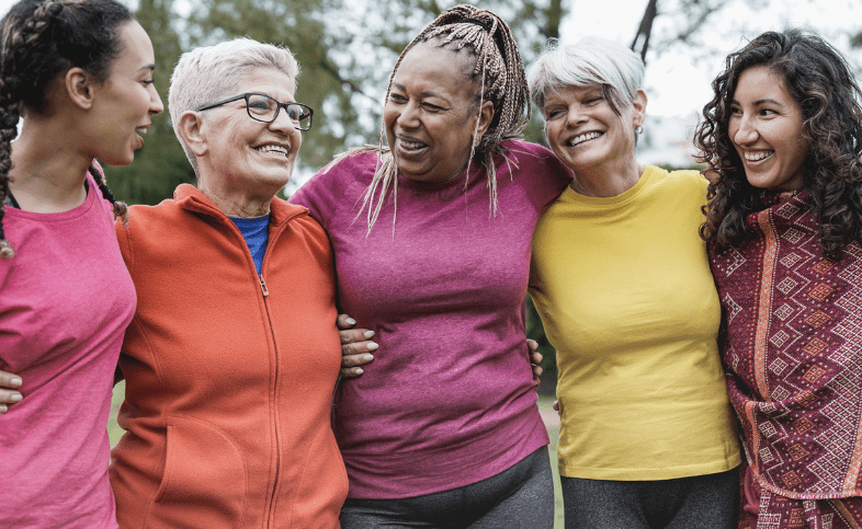 A group of women with their arms around one another