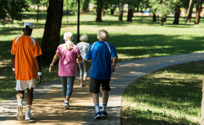 Group of people walking together in the park